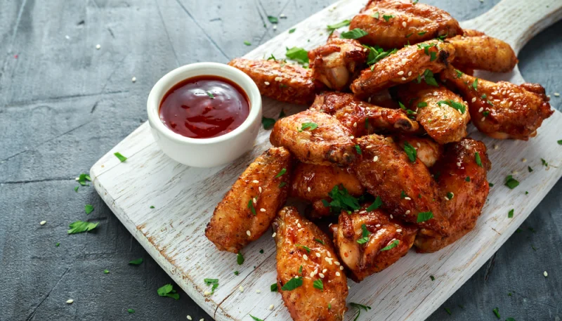 Ailes de poulet au Coca, oignons et gingembre